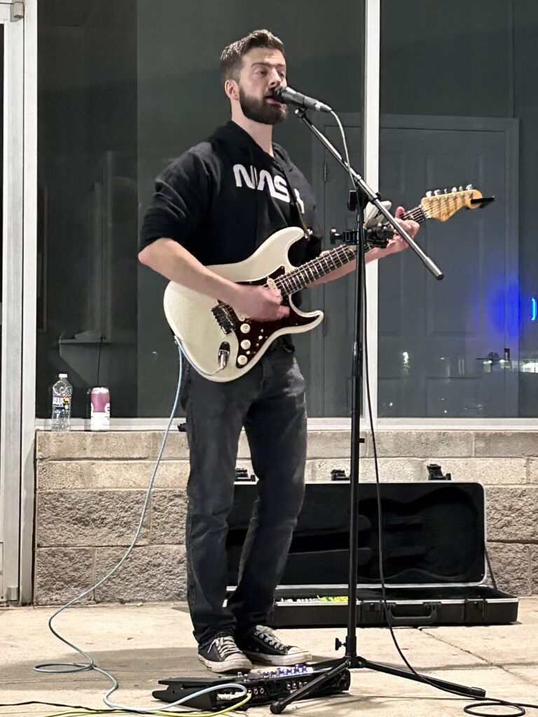 Josh from Cigarette Trees singing and playing guitar at Dave's BBQ in Georgetown, KY