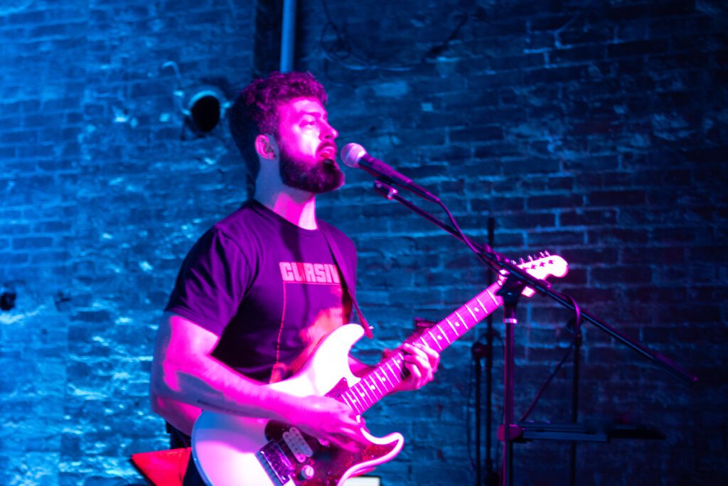 Lead singer of Cigarette Trees performing at Green Lantern Bar